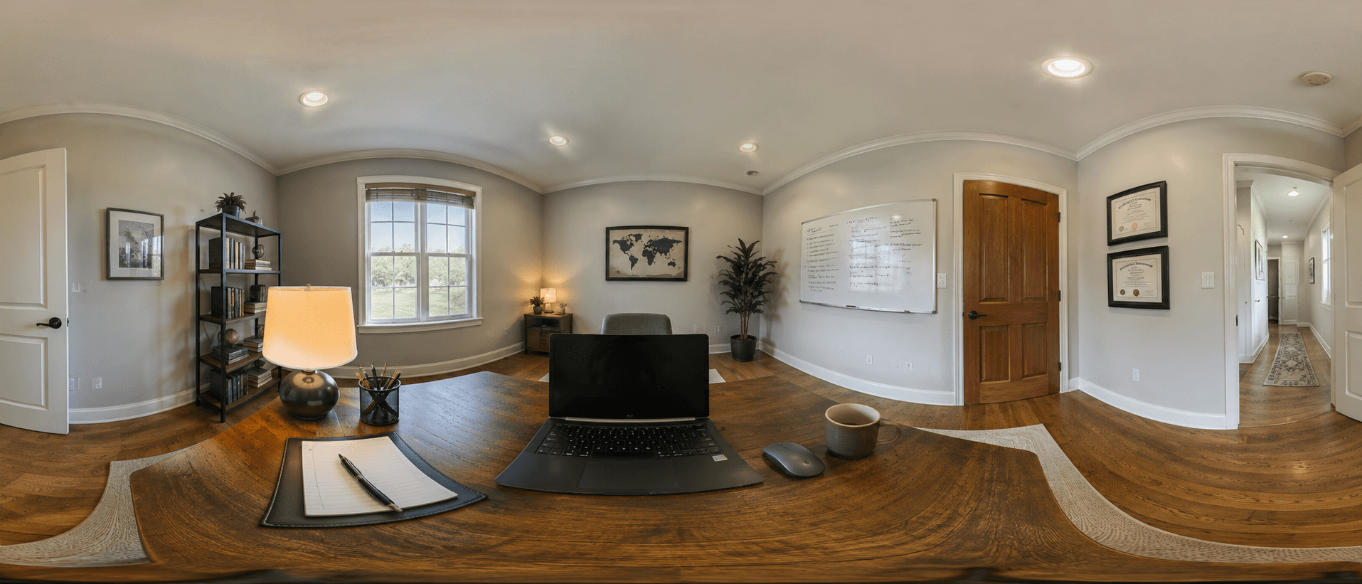360-degree exam monitoring panoramic capture of a student's home office, showing the desk, laptop, and every wall of the room in a single frame